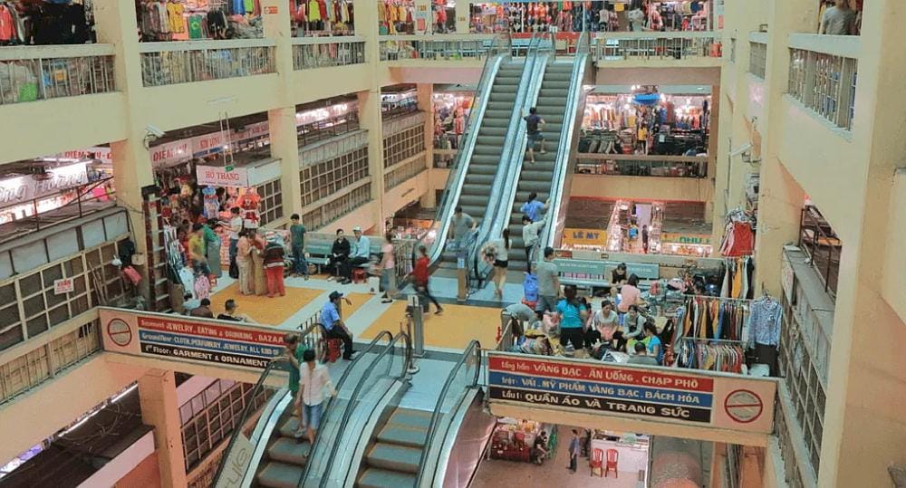A top-down view of An Dong Market's floors filled with stalls, seen from the central stairway